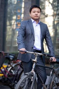 White-collar workers Manager Parking Bicycle Asians Adult male Staff The Blue Stock Photos