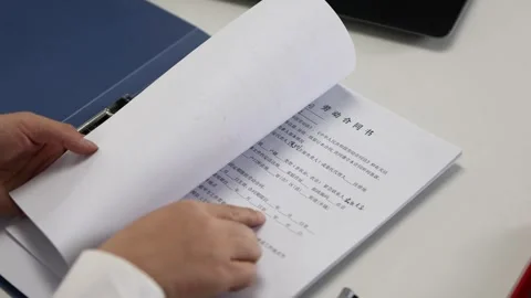 White-collar workers signing contract documents in the office Stock Footage 328400071