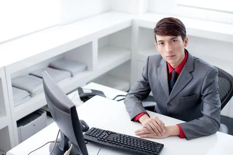 White-collar workers Staff a man Oriental Oriental figures Asian Alone Young men Stock Photos