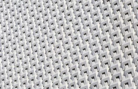 White color 3D pattern of modern building facade in the sunlight 库存照片