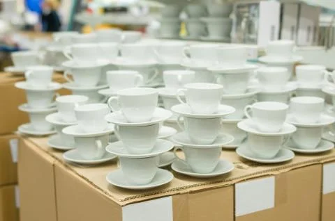 White color tea cups in boxes in supermarket Stock Photos