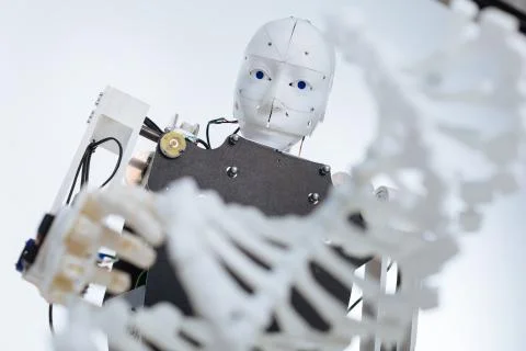 White complex robot studying the genome Stock Photos