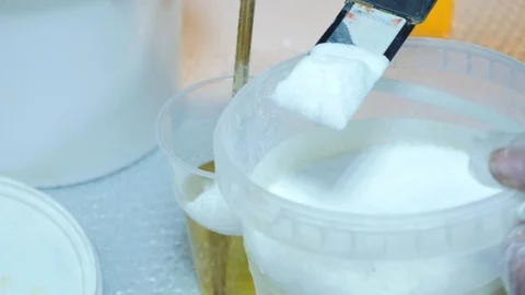 A white component will be added to the epoxy glue to add volume. The composition Video stock 102396927