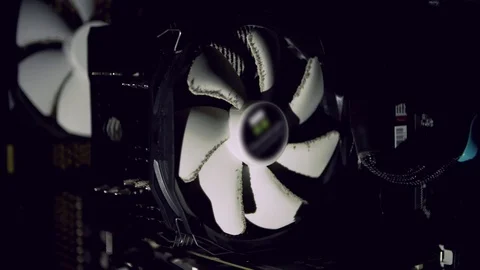 White computer fan cooling dark dusty computer. PC cooler starts Video stock 83357872