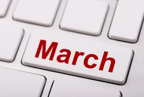 A white computer keyboard key labeled "March" in red letters, representing .. Stock Photos