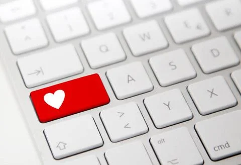 White computer keyboard with red heart button White computer keyboard with... Stock Photos