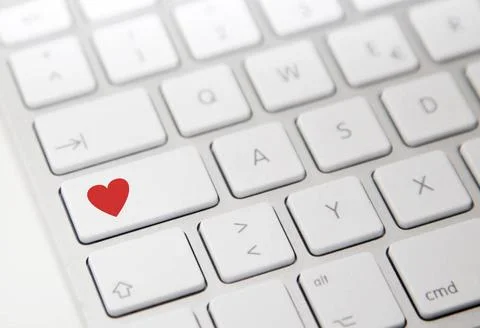 White computer keyboard with red heart button White computer keyboard with... Stock Photos