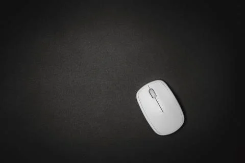White computer mouse on black background, minimalism black. Stock Photos