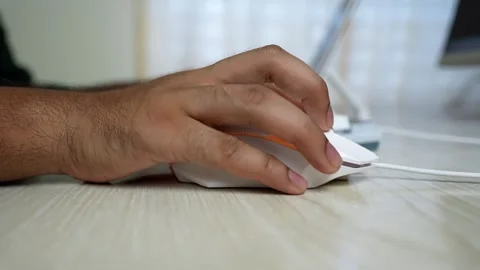 White Computer Mouse on Wooden Desk Stock Footage 320724757