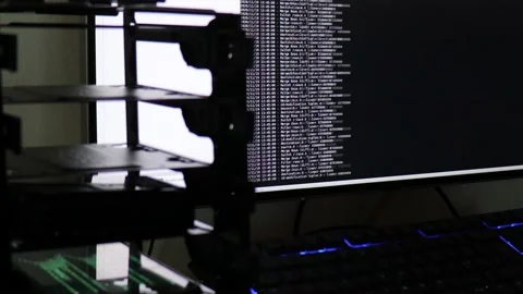 White computer software code moving on a black monitor reflect on glass. Abst Stock Footage 143674521