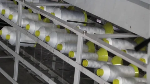 The white of the cone threads from textile factory, cloth manufacturing Stock Footage 83782068