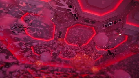 White confetti fall against blurry illuminated stage in banquet hall Stock Footage 142198364