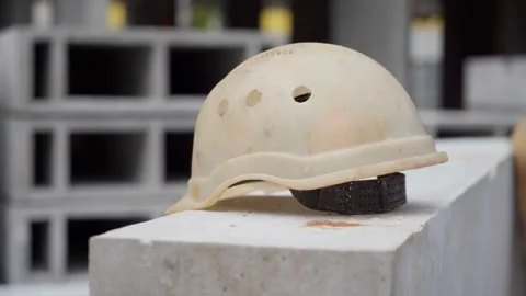 A white construction helmet lying on the concrete. Stock Footage 279066078