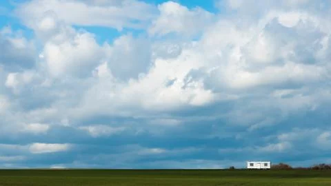 White construction trailer with rain clouds Foto stock