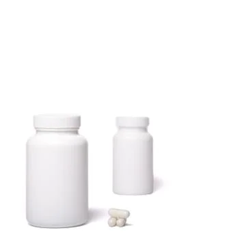 White containers with no logo. Boxes with ccccapsules isolated on a white. Stock-Fotos