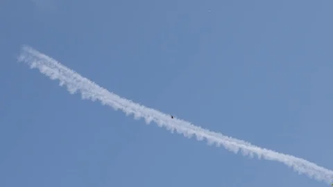 White contrails produced by engine exhaust on the sky Stockbeeldmateriaal 81824836