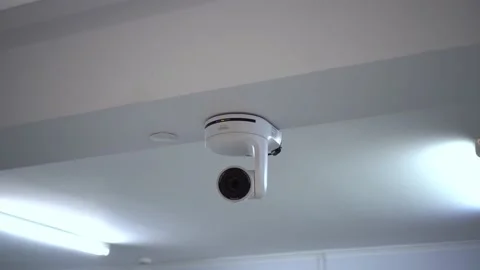A white controllable camera is filming. Ceiling-mounted camera for live Stock-Footage 227038048