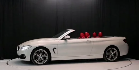 A white convertible car with red interior Stock Footage 243345197