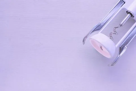 White corkscrew on a pink background. The concept of party or celebration Stock Photos