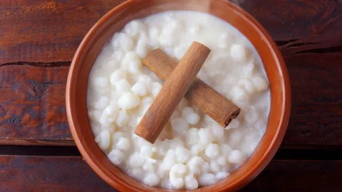 White corn cooked with milk known as canjica, canjico or mungunza Stock Footage 146617873
