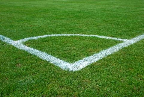 White corner lines on empty soccer grass field Stock Photos