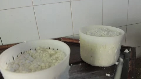 White cottage cheese preparation in two bowls, scoop puts more into one of them. Stock Footage 202085718