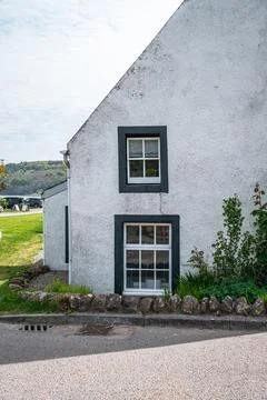 White cottage with dark framed windows Stock Photos