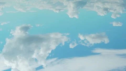 White Cotton Cumulus Clouds Float Across the Clear Blue Sky During the Day Time  Stock Footage 314716019