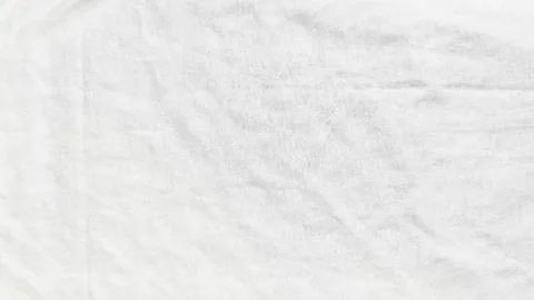 White cotton fabric background featuring soft natural creases and fine knit t 스톡 사진
