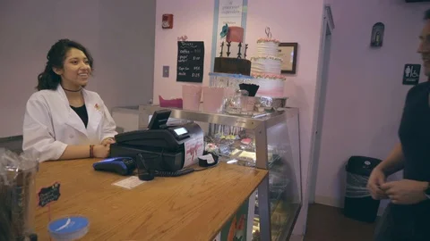 White Couple Ordering at Register 1 Stock Footage 92547922