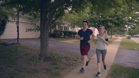 White Couple Running 1 Stock Footage 92546319