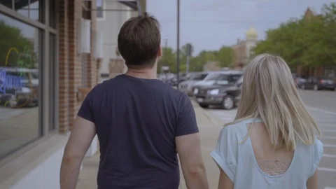 White Couple Walking down Sidewalk 2 Stock Footage 92546773