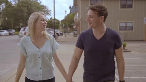 White Couple Walking down Sidewalk 4 Stock Footage 92546796