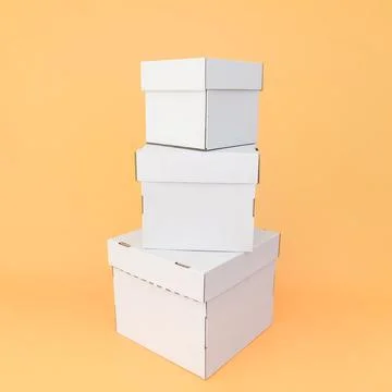 White craft boxes stacked on top of each other on an orange background. The.. Stock Photos