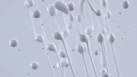White cream droplets and strings in mid air Stock Footage 219492325