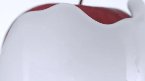 White cream enveloping apple upside down Stock Footage 219464532