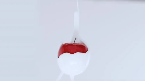 White cream streaming from apple, upside down Stock Footage 219464943