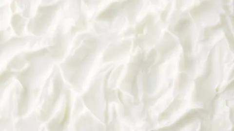 White Cream Texture Rotating  Overhead Cosmetic Skincare Loop Stock Footage 317316904