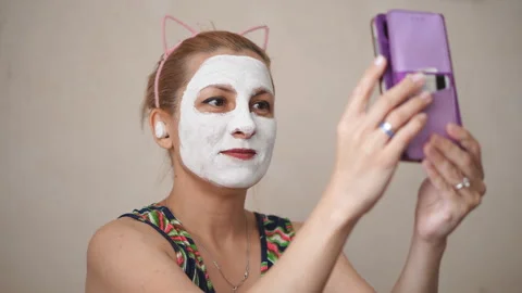 White cream on a woman's face Stock Footage 201814083