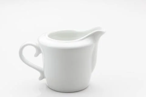 White creamer container on white background. Stock Photos