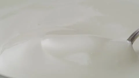 White creamy sauce texture close-up. Dip a spoon into white yogurt macro. Dairy Stock Footage 270018982