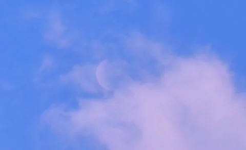 A white crescent or half moon in a blue sky. 스톡 동영상 319418543