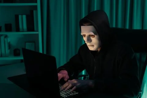 White criminal anonymous mask installing coding password encryption. Pecuniary. Stock-Fotos