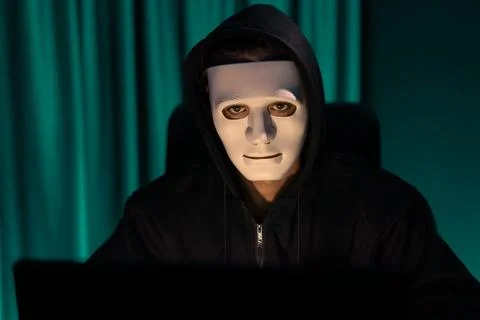 White criminal anonymous mask installing coding password encryption. Pecuniary. 스톡 사진