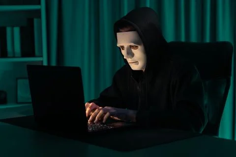 White criminal anonymous mask installing coding password encryption. Pecuniary. 写真素材