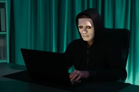 White criminal anonymous mask installing coding password encryption. Pecuniary. 写真素材