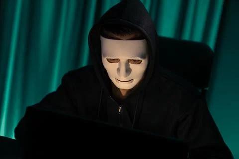 White criminal anonymous mask installing coding password encryption. Pecuniary. Stock-Fotos