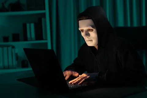 White criminal anonymous mask installing coding password encryption. Pecuniary. Stock-Fotos