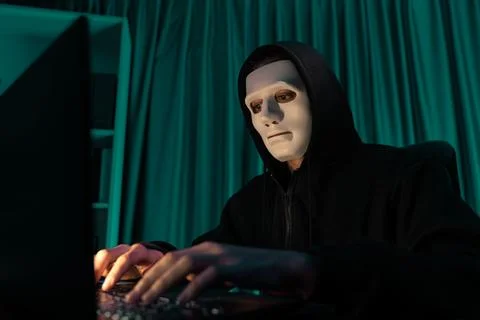 White criminal anonymous mask installing coding password encryption. Pecuniary. Stock-Fotos