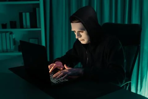 White criminal anonymous mask installing coding password encryption. Pecuniary. Stock-Fotos